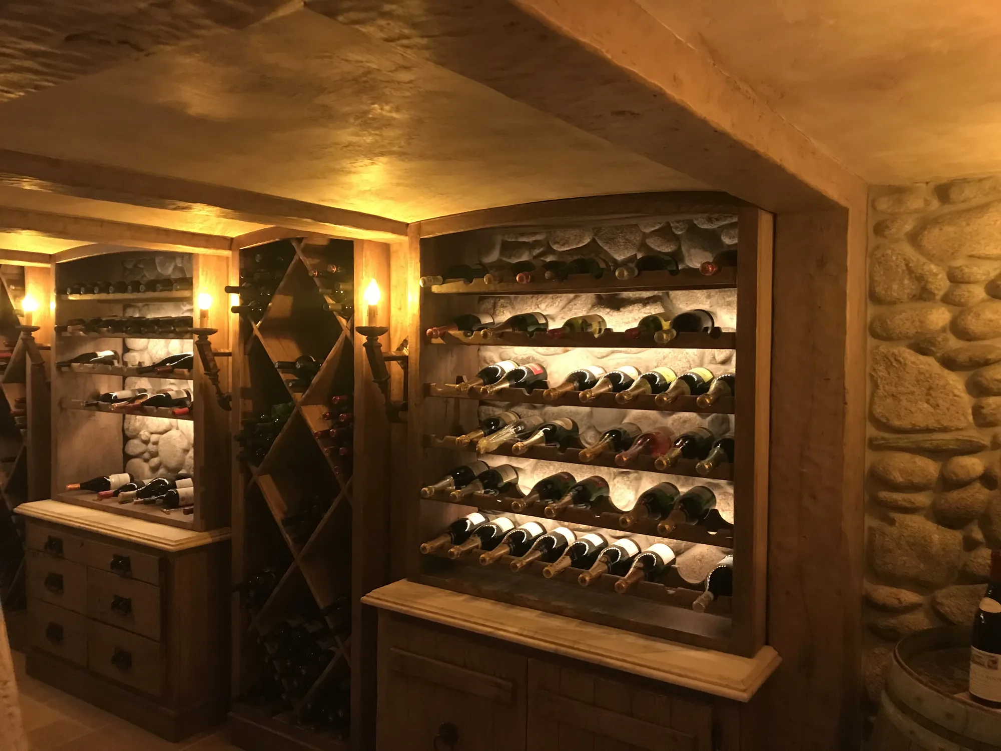 Wine cellar with stone vault and X-pattern racks